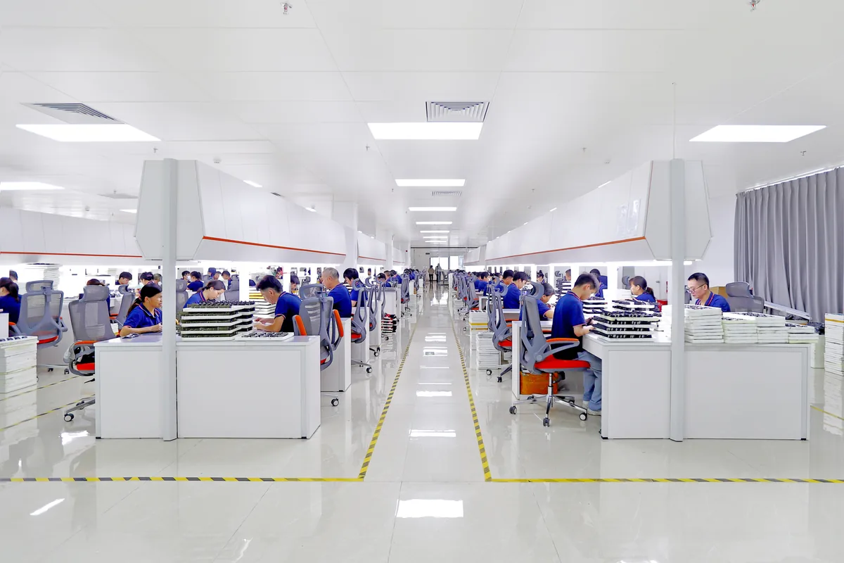 SKMEI watch assembly line with workers
